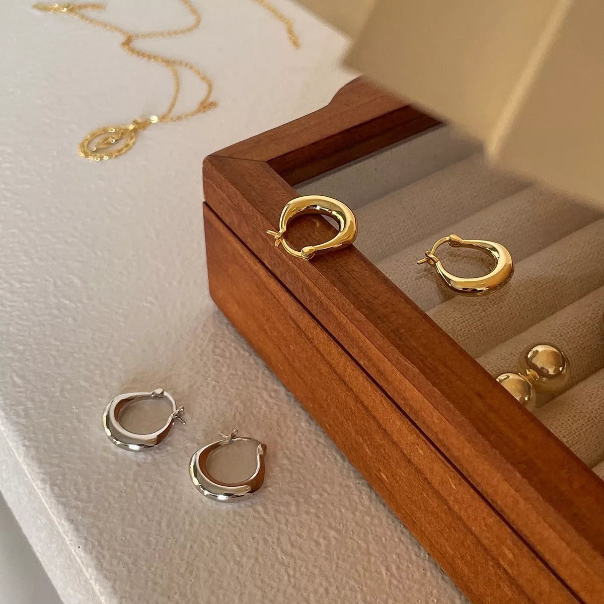 Small Fat Circle Ear Clip Bracelet in white gold and yellow gold colors