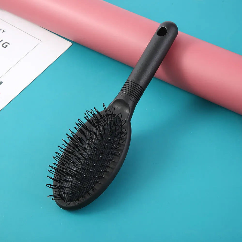 Black ring tooth hair extension comb with airbag design showing 22cm length