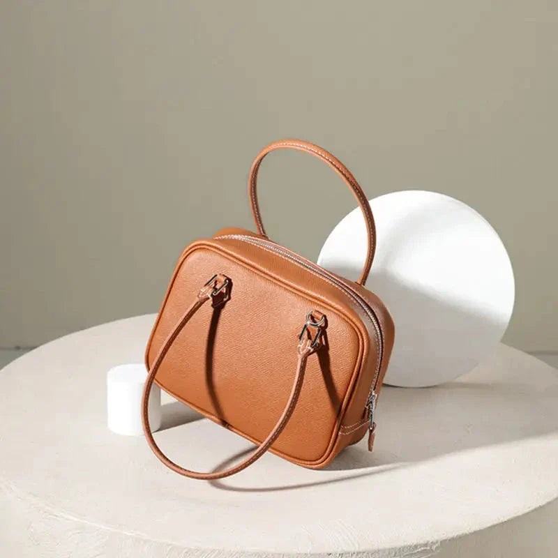 Leather Mini Shoulder Bag in Pink, featuring a compact square shape and crossbody design for versatile everyday use