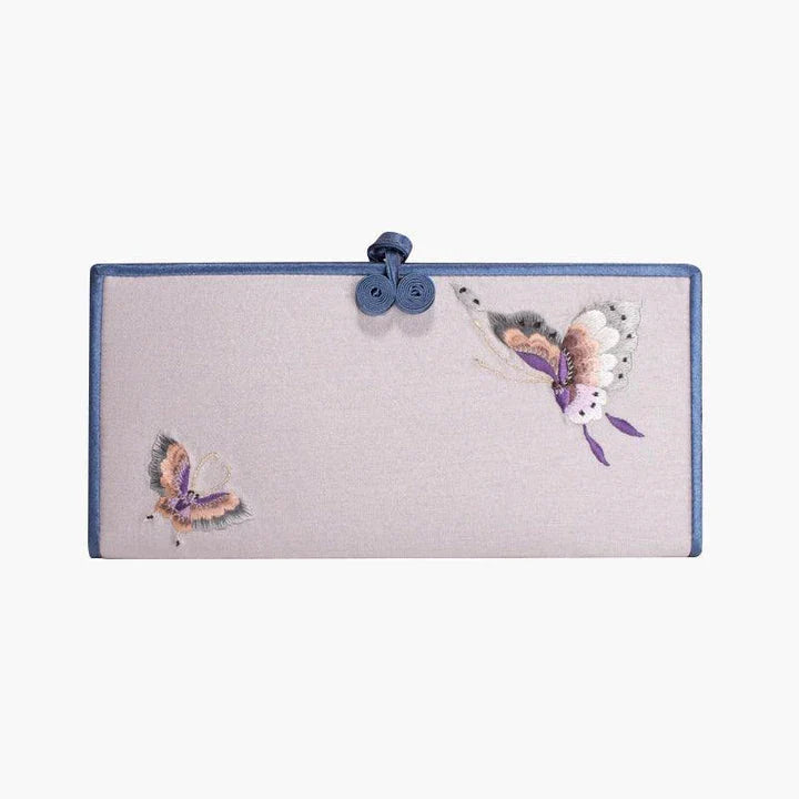 Elegant hand-embroidered long wallet in various colors, featuring a sleek buckle design and ample storage space