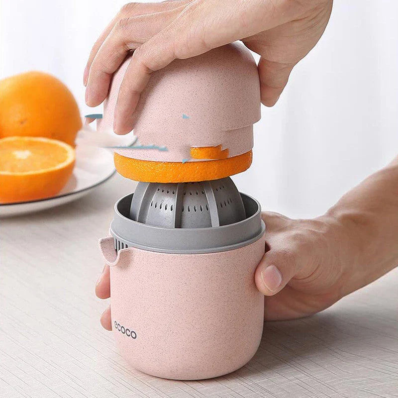 Versatile manual citrus juicer for extracting nutritious juices from oranges, lemons, grapefruits, and more using a compact and durable design