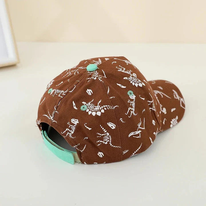 Adjustable kids' baseball cap with vibrant dinosaur prints, designed for comfort and sun protection during outdoor activities.