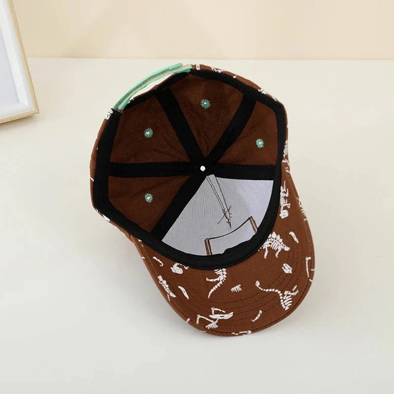 Adjustable kids' baseball cap with vibrant dinosaur prints, designed for comfort and sun protection during outdoor activities.