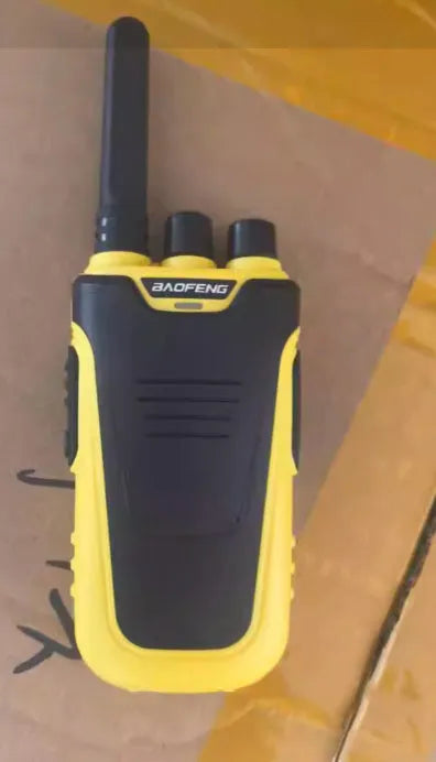 Red and yellow high-power handheld intercom for hotel and restaurant staff communication.