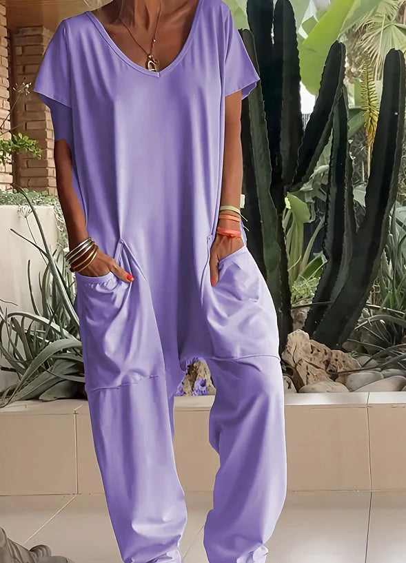A stylish and comfortable oversized jumpsuit with roomy pockets, available in a variety of vibrant colors.