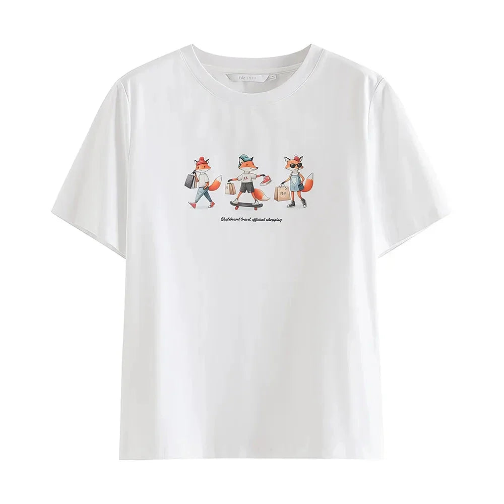 Women's white t-shirt with a playful cartoon fox print design, perfect for summer fashion.