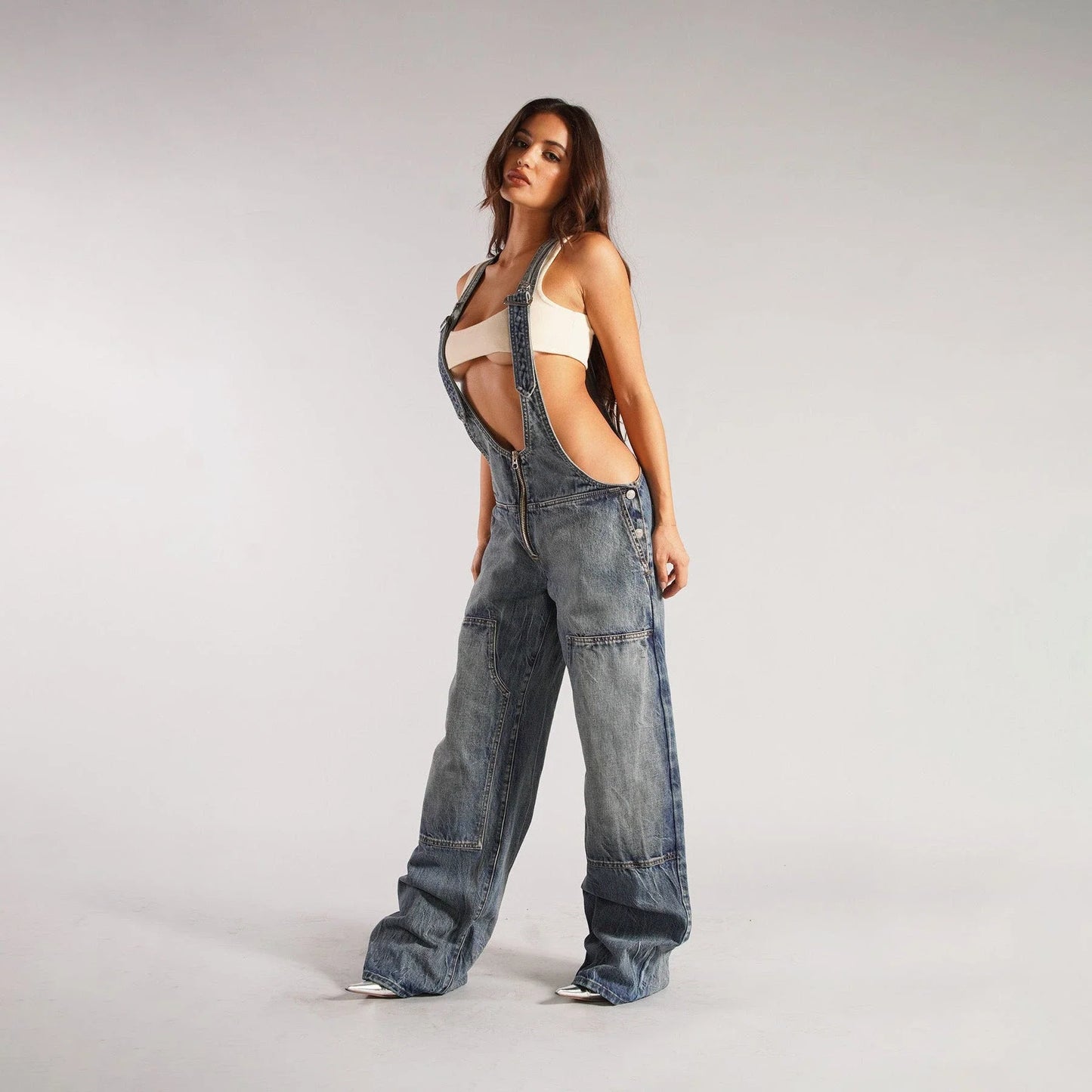 Fashionable Y2K-inspired denim overalls with pockets, suspenders, and a loose, comfortable fit