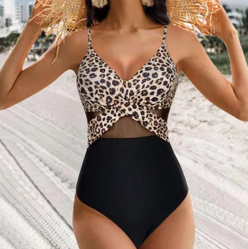 Halter one-piece swimsuit with cross-strap design, available in various solid colors and leopard print