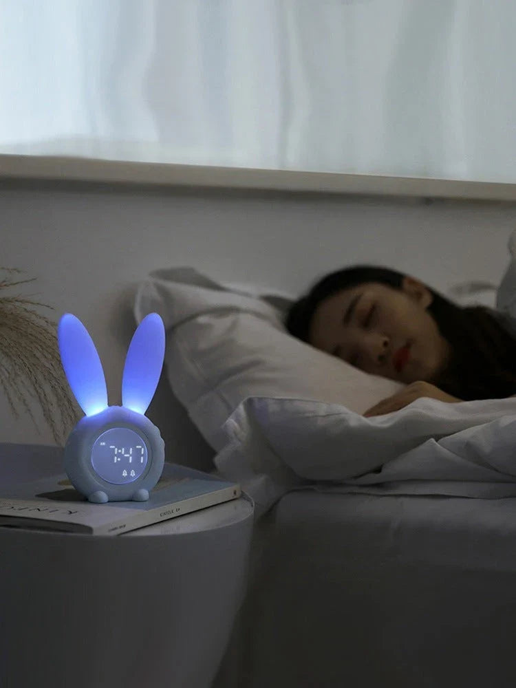 Adorable bunny-eared LED alarm clock with sound control, available in blue, green, and pink colors