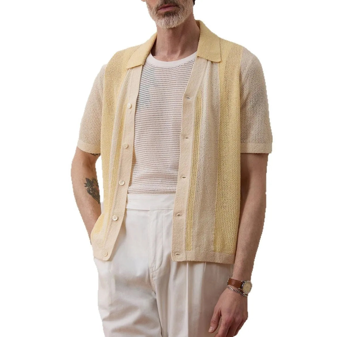 Yellow asymmetric short-sleeved polo shirt with hollow-out design on a hanger.