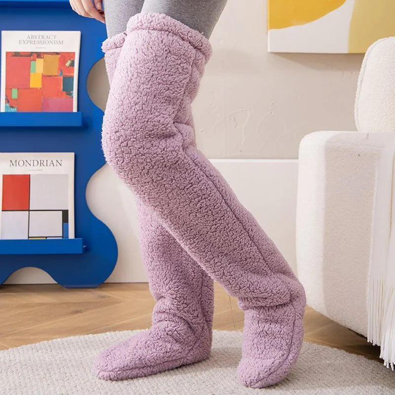Cozy over-the-knee fuzzy socks in various colors, including brown, blue, dark gray, pink, silver, and more. Comfortable cotton design for warm, snug legs.