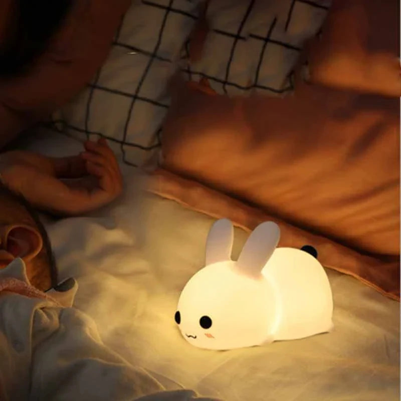 Dimmable rabbit-shaped night light with soft silicone design and adjustable brightness for children's bedrooms
