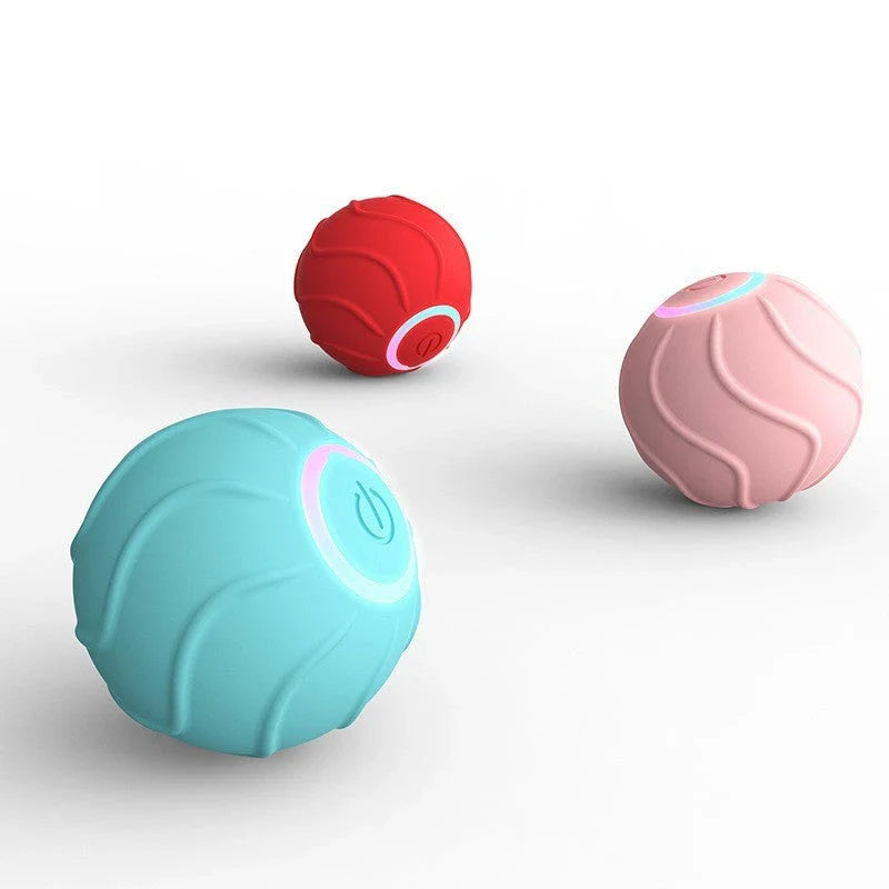 Automatic self-rolling interactive cat toy ball in blue, red, and pink colors with USB charging and bouncing action to engage cats