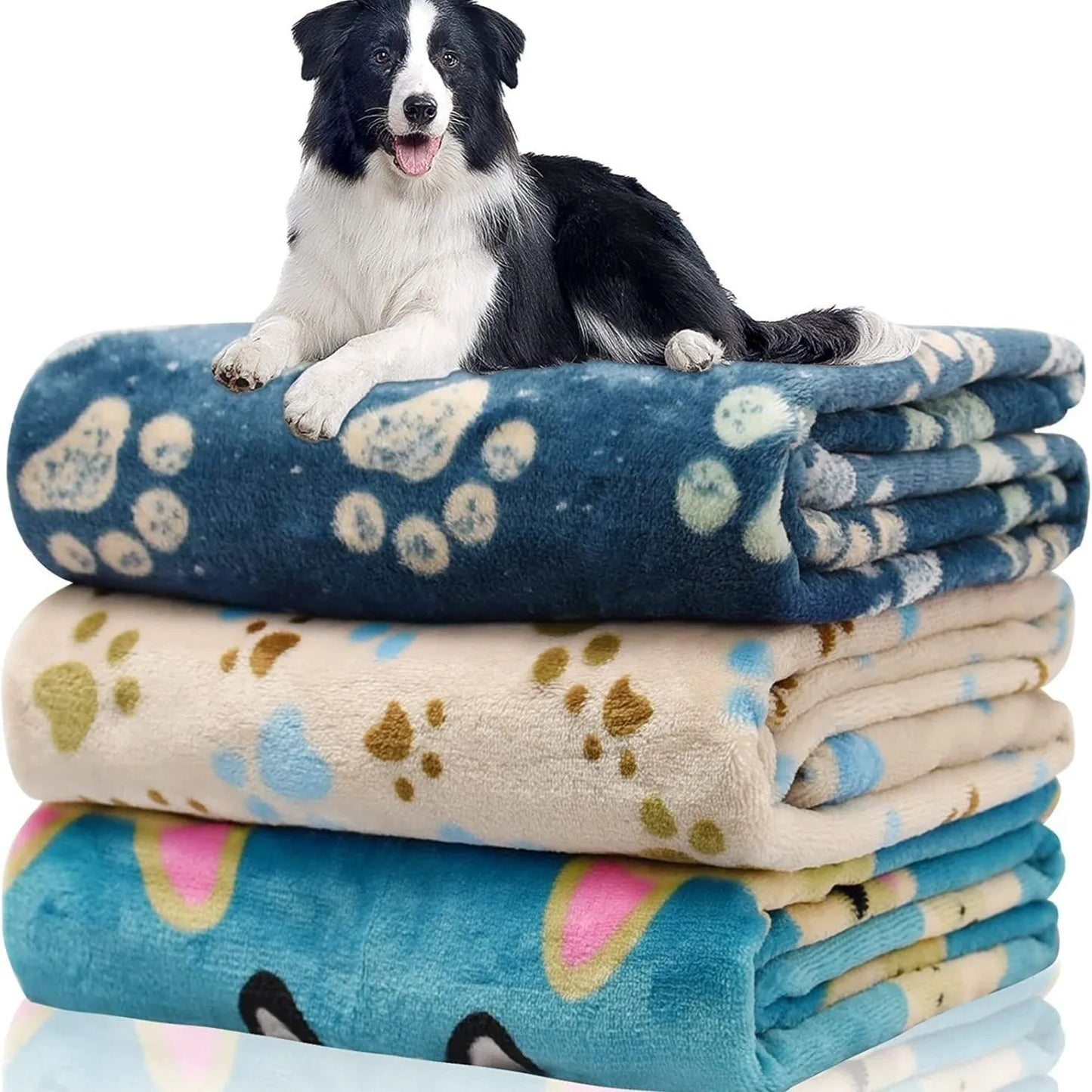 Blue dog cartoon print double-sided flannel pet blanket shown in a dog crate.