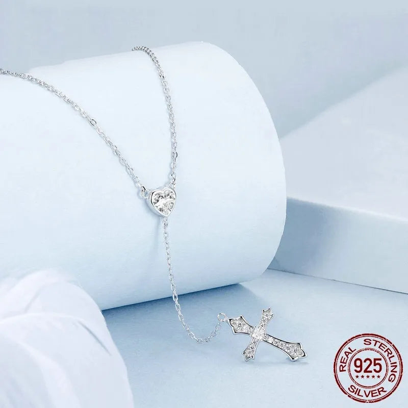Silver cross pendant necklace with V-neck design on O-ring chain
