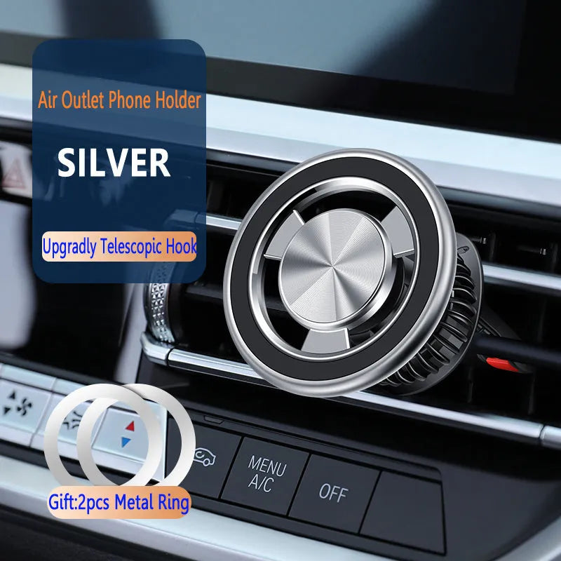 Silver magnetic phone holder clipped onto a car air vent, showing the bracket and separate magnetic metal plate.