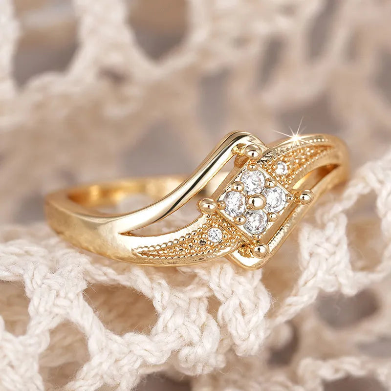 Yellow gold coloured copper diamond ring with micro inlaid zircon geometric ornamentation.