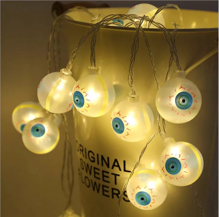 Battery-powered LED skeleton skull string lights for Halloween decor with durable plastic construction