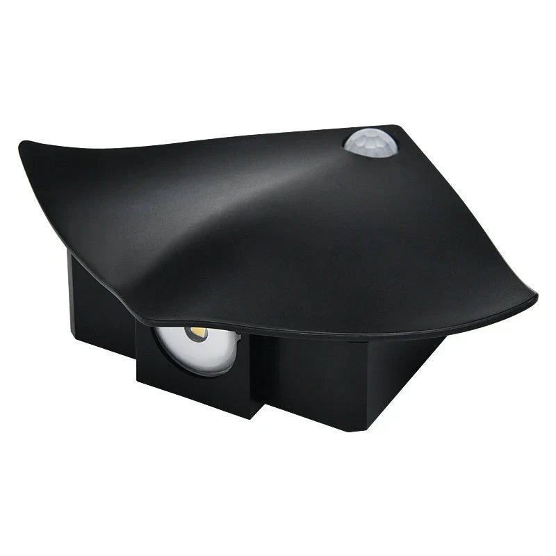 Wireless motion-activated wall lamp with USB recharging, available in black or white finish