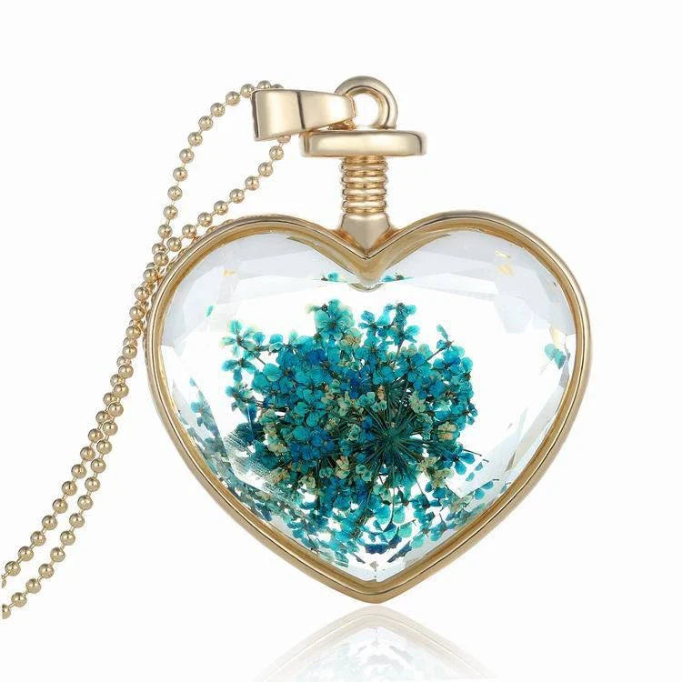 Elegant round pendant necklace with dried flower specimen in various colors including yellow, blue, purple, red, and orange
