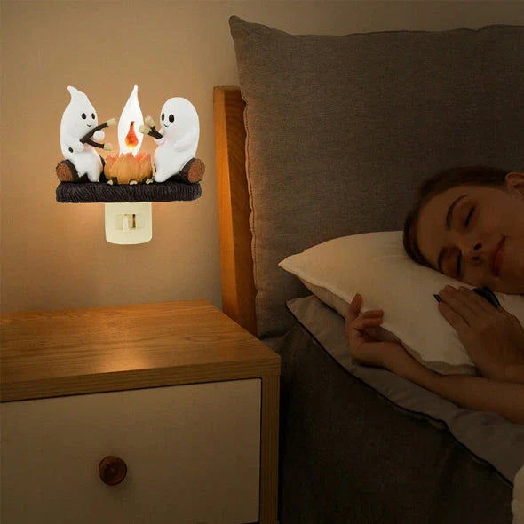 A spooky yet adorable nightlight featuring a friendly ghost enjoying a cozy campfire, creating a warm and soothing ambiance for any room.