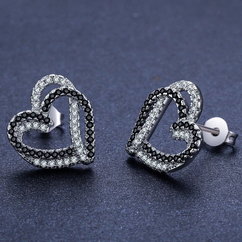Stylish copper heart-shaped earrings with a double buckle closure, a trendy and elegant fashion accessory