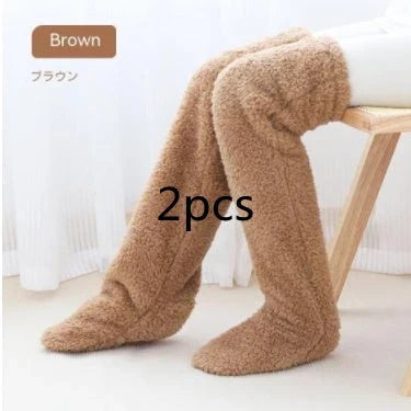 Cozy over-the-knee fuzzy socks in various colors, including brown, blue, dark gray, pink, silver, and more. Comfortable cotton design for warm, snug legs.