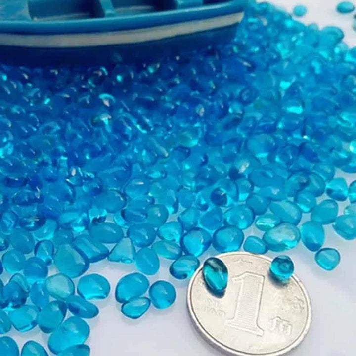 Premium blue gravel for aquarium decoration, featuring vibrant shades and a smooth texture to create a serene and calming underwater environment.