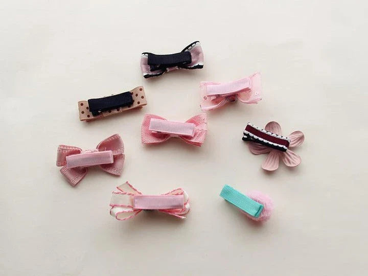 Colorful and stylish hair accessories for dogs, including bows and clips in various shades to complement your furry friend's unique personality.