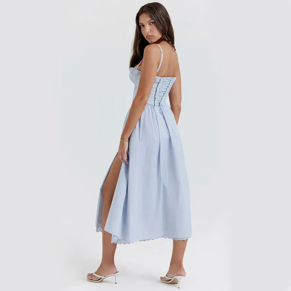 A stylish blue midi crochet dress with a floral pattern and spaghetti straps, perfect for summer occasions.