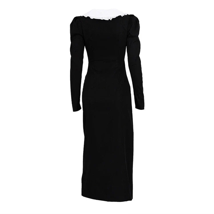 Black and white color-blocked dress with long sleeves and a doll collar, showcasing a timeless and sophisticated style.