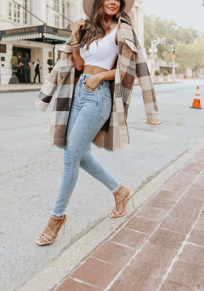 A fashionable women's plaid woolen jacket with a relaxed fit, featuring a timeless plaid pattern and polyester construction for comfort and durability.