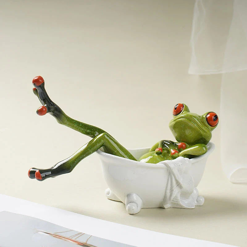 Resin frog figurines in a bathtub, adding a playful touch to bathroom decor