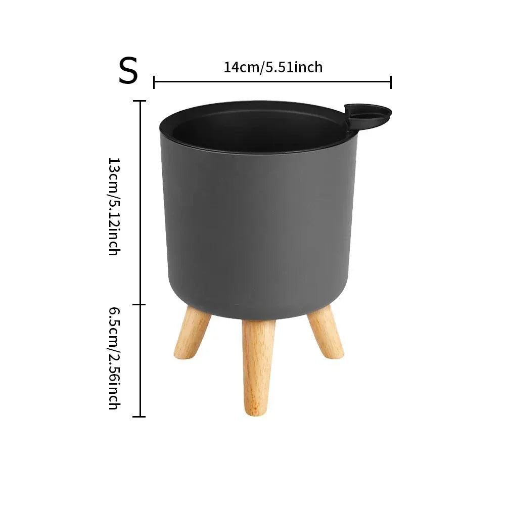 A modern self-watering planter with a wooden stand, designed to simplify indoor gardening and enhance any space with its chic and functional features.