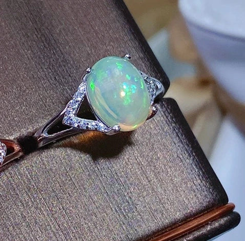 Elegant 925 silver ring featuring a captivating natural Australian opal with a mesmerizing play of colors