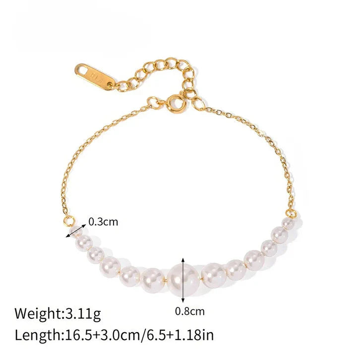 Elegant pearl and gold-plated stainless steel necklace/bracelet with lustrous pearls and vintage-inspired design