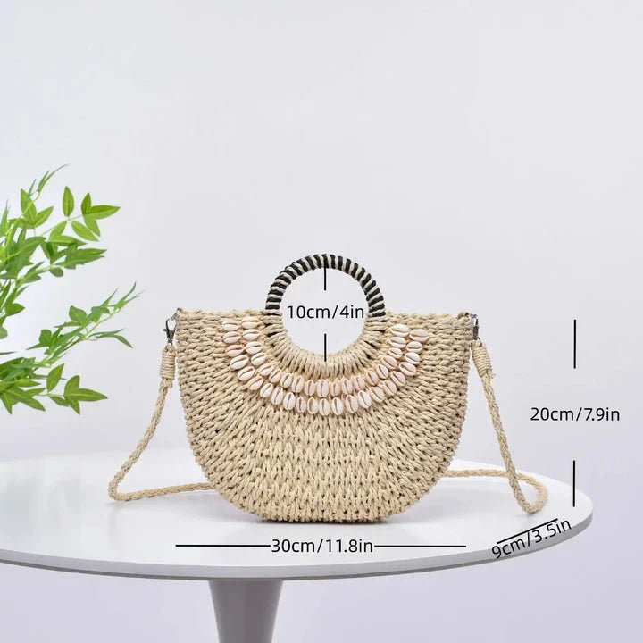 Handmade straw woven crossbody handbag with seashell accents, perfect for summer beach and resort wear