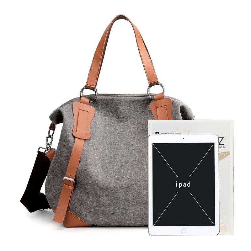 Versatile canvas shoulder bag in khaki color with multiple pockets and adjustable strap for everyday use