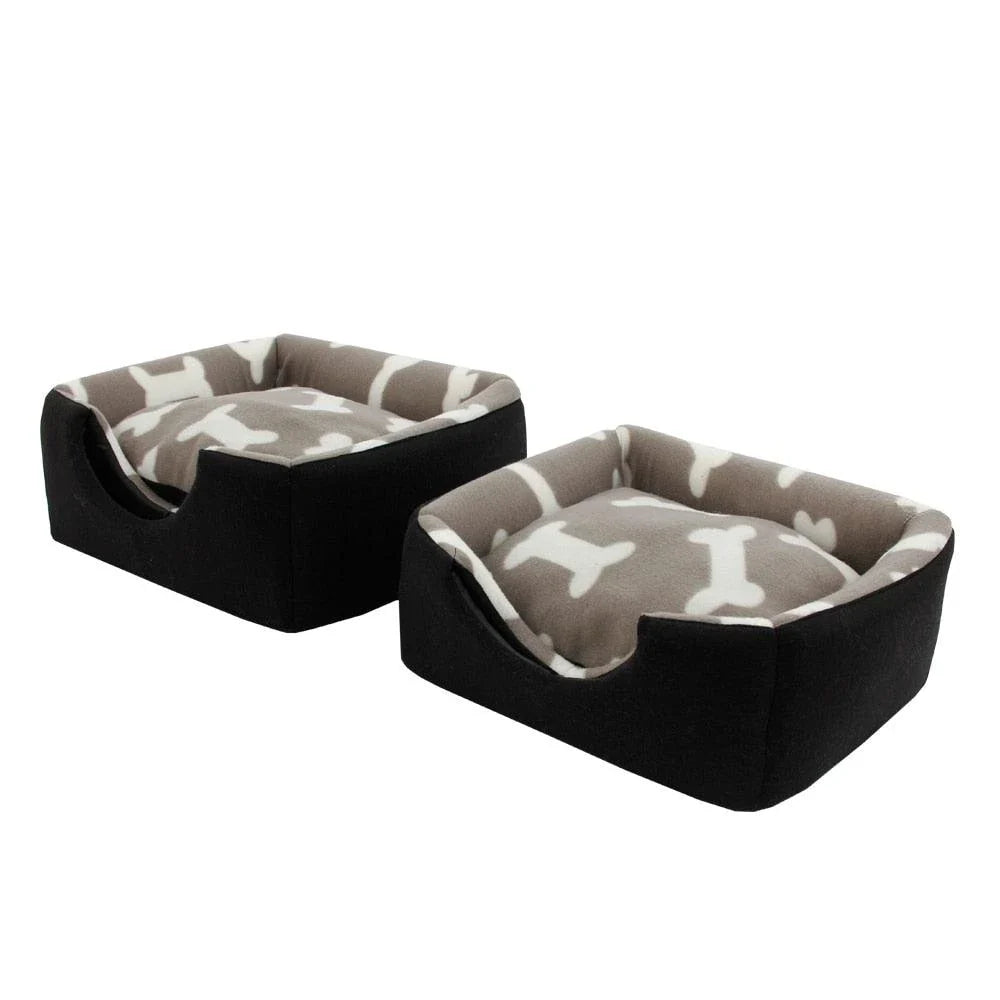A plush, white pet bed with a stylish paw print design, providing a cozy and comfortable resting space for dogs or cats.