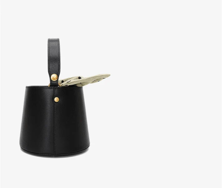 Premium leather bucket bag tote with bow-type closure, exquisite golden hardware, and versatile design