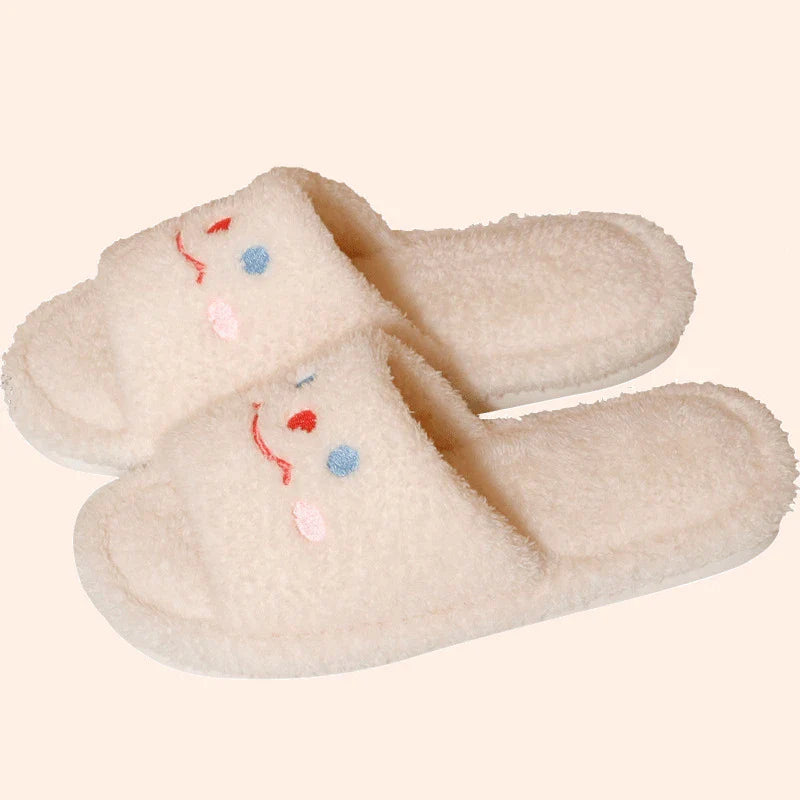 Cozy plush slippers with a smiling face design for comfortable indoor wear