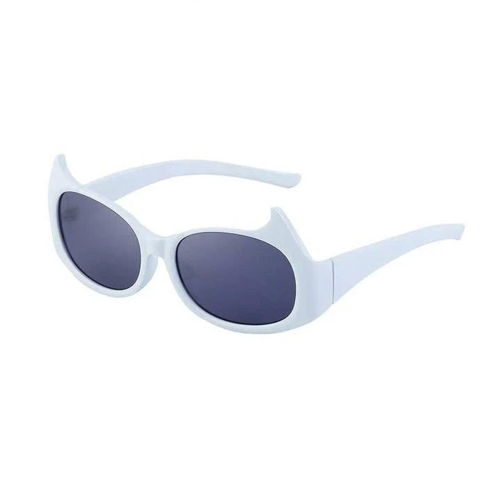 Stylish cat-eye sunglasses with oversized frames, semi-rimless design, and punk-inspired detailing for a timeless, glamorous look