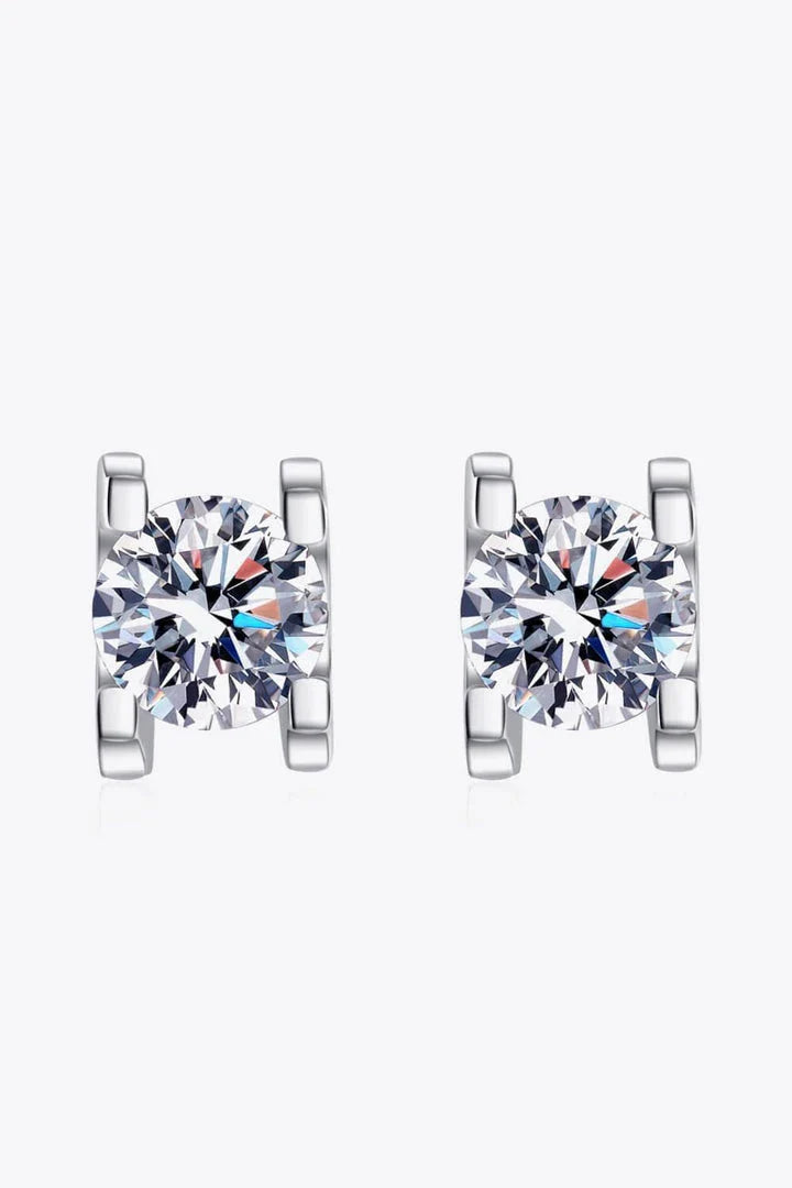 A pair of 1 carat moissanite stud earrings made of 925 sterling silver with a rhodium plating for a dazzling shine.