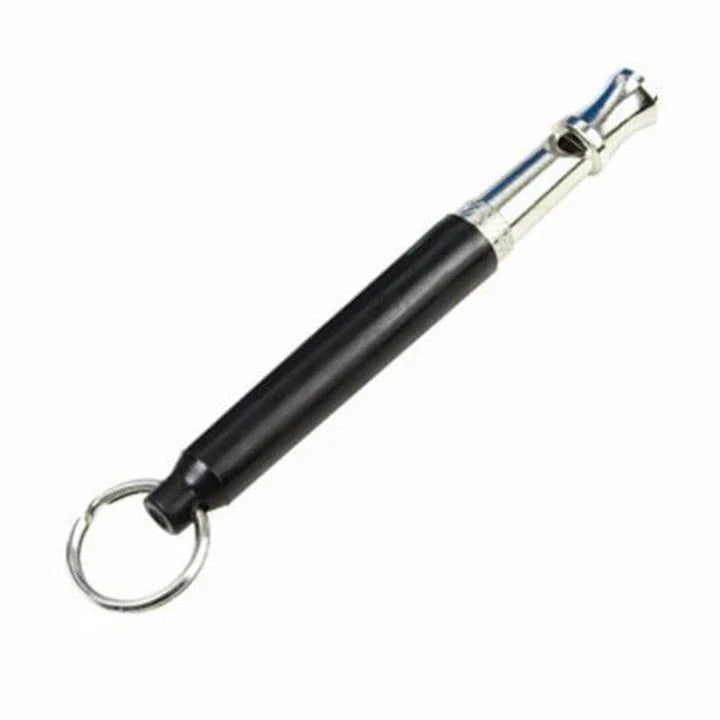 Compact dog training whistle made of metal and plastic with a black and silver design