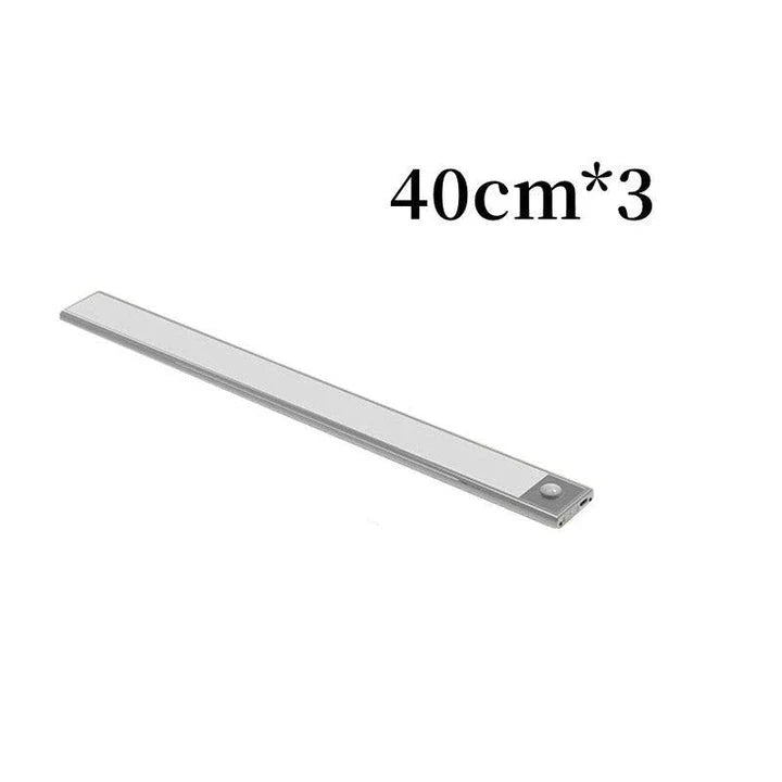 Motion-activated LED under cabinet light with USB rechargeable battery and automatic day/night sensing for kitchen, closet, and indoor use