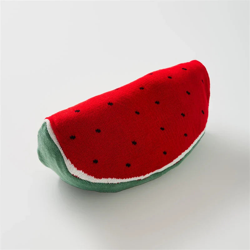 A colorful, fruit-themed accent pillow with a cozy, plush design for comfortable home decor