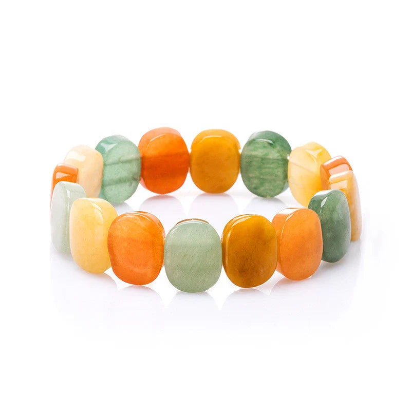 Closeup of a natural tiger eye crystal bracelet with a geometric design, showcasing its unique and calming beauty.