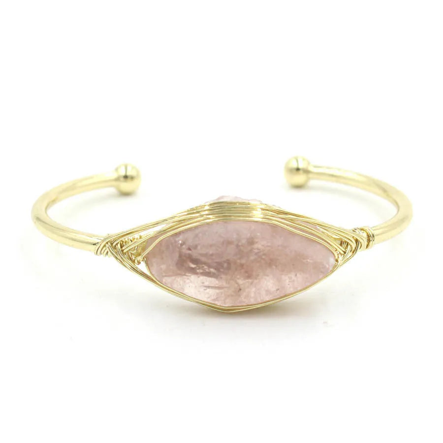 Natural raw gemstone bracelet with 8mm rough crystal beads in ethnic style, shown on wrist.