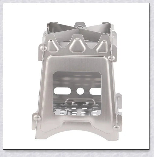 Portable titanium camping stove with folding design and open flame for cooking with natural fuels in the outdoors