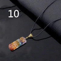 A stylish 7-chakra crystal pendant featuring a unique geometric design and natural stone patterns
